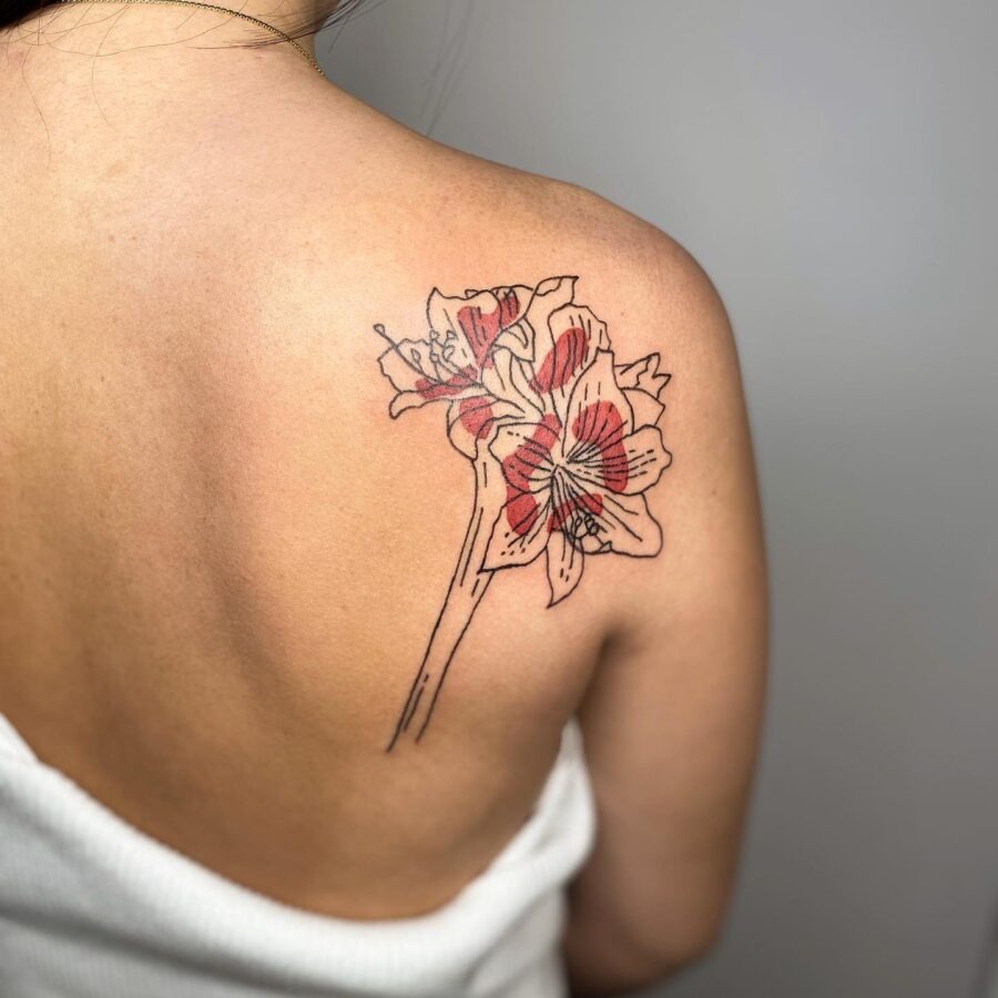 Beautiful Amaryllis Tattoo on the Back Tattoo Design