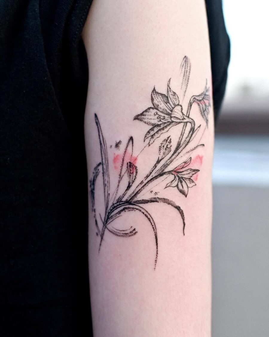 Delicate amaryllis tattoo with gentle colors Tattoo Design
