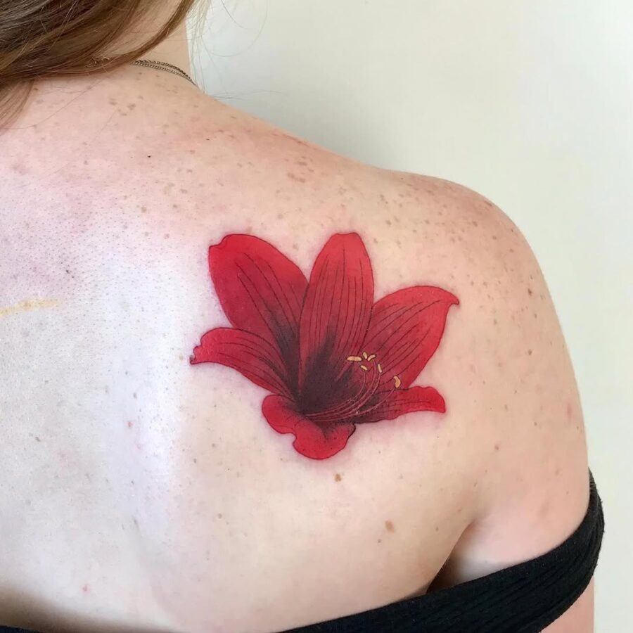 Stunning red amaryllis shoulder tattoo design Tattoo Design