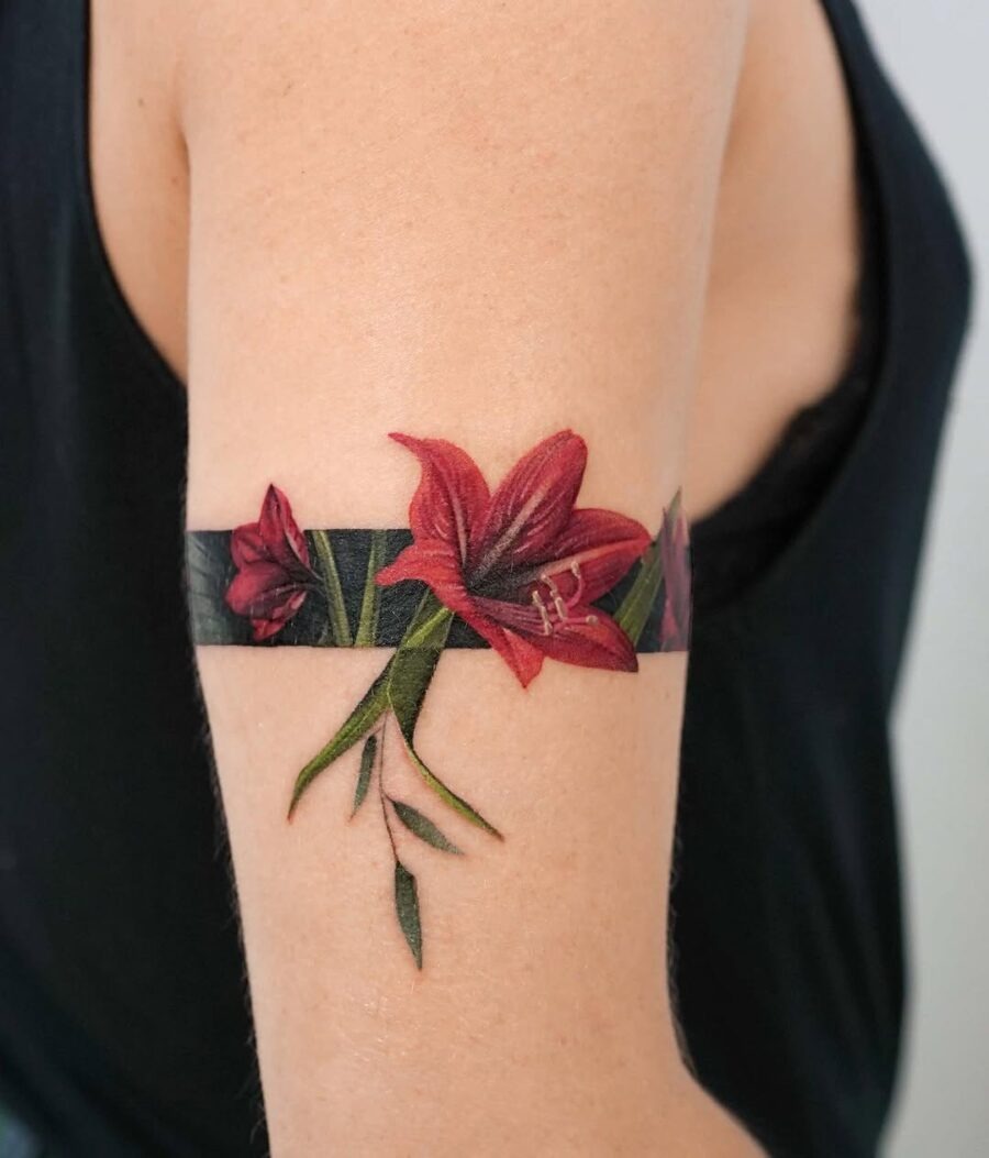 Vibrant amaryllis flower tattoo on arm Tattoo Design