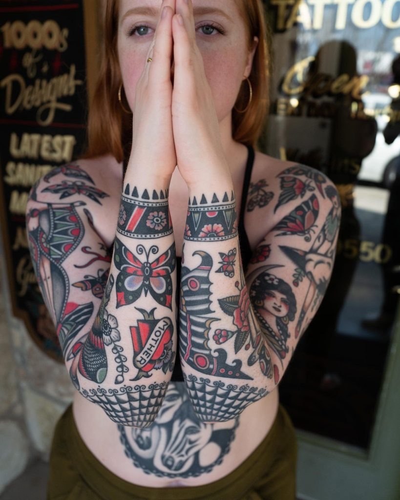 American traditional skull tattoo smoking a cigarette under a wide cowboy hat