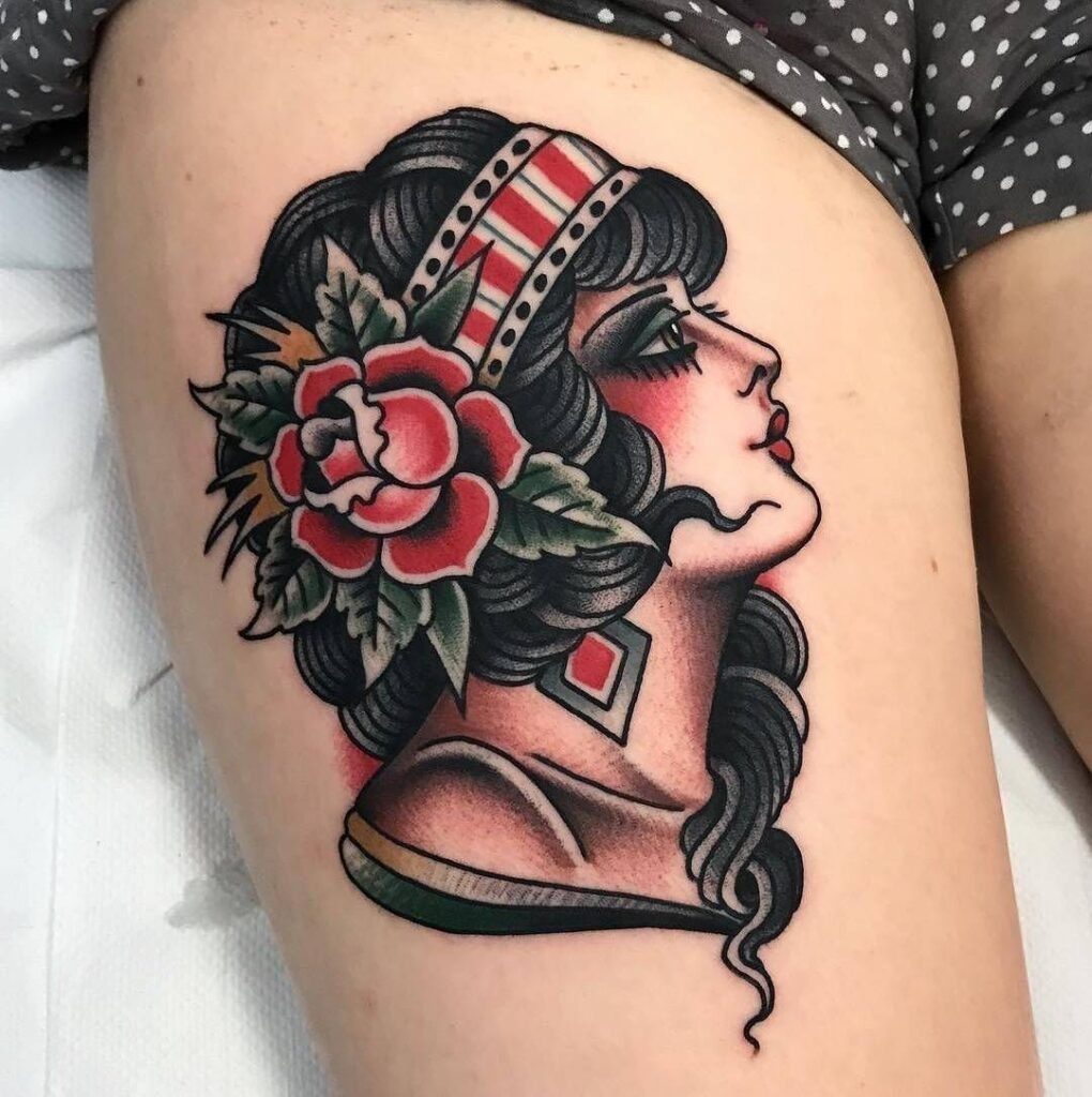 American traditional eagle tattoo clutching national flag banner on upper chest