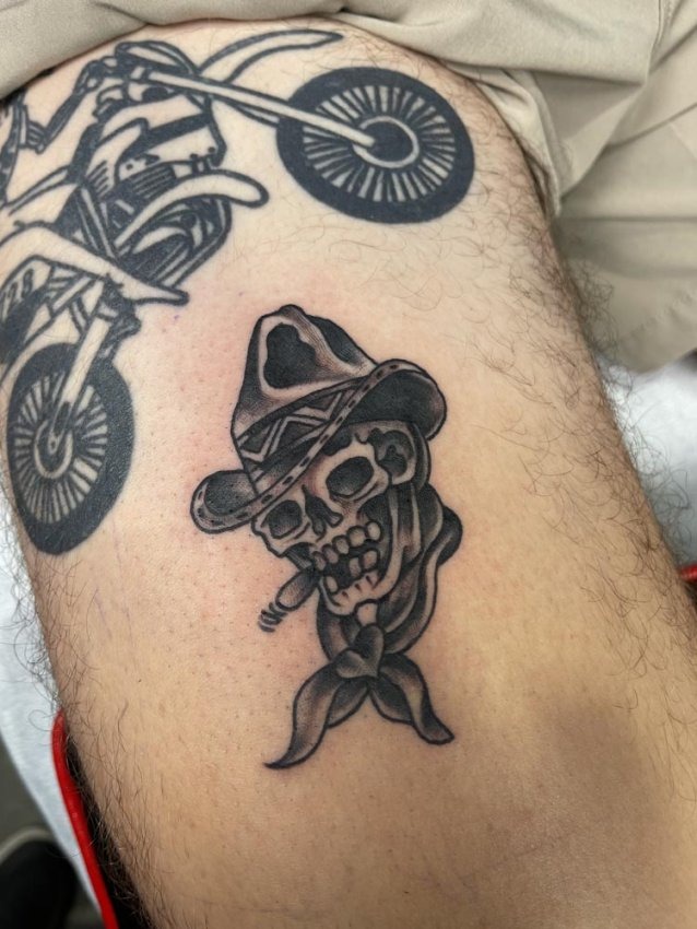 American traditional coiled rattlesnake tattoo with bared fangs on lower calf