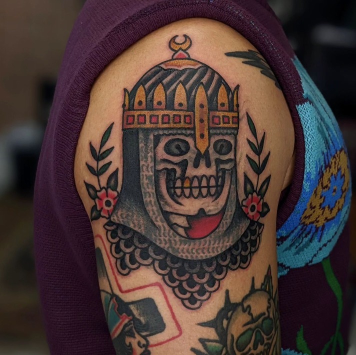 American traditional skeleton knight tattoo in full iron armor holding a broadsword