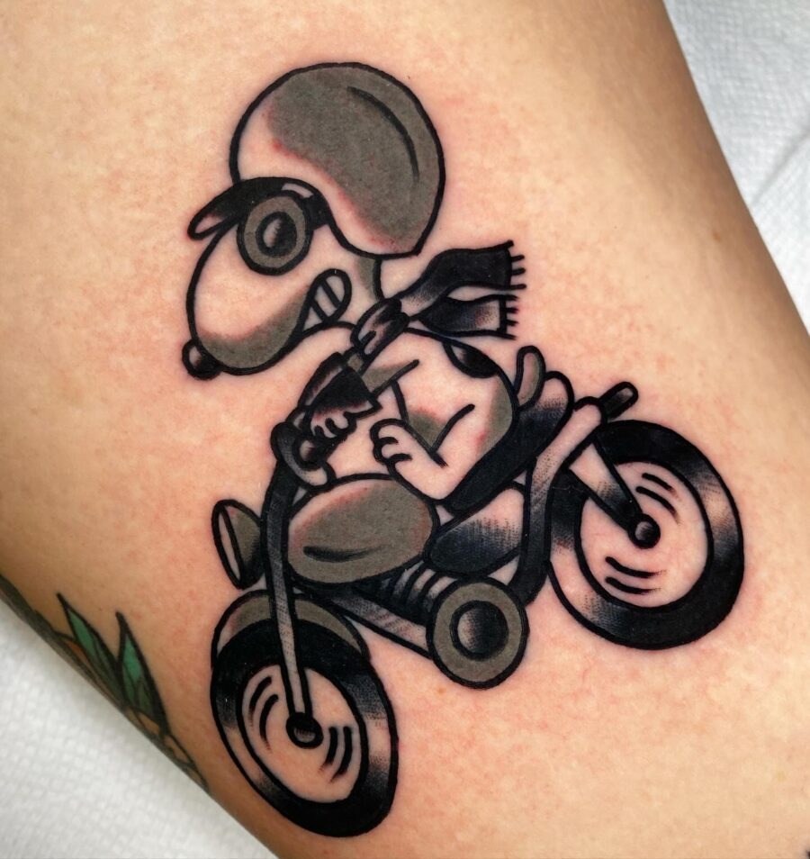 Classic Americana tattoo featuring Snoopy riding Tattoo Design