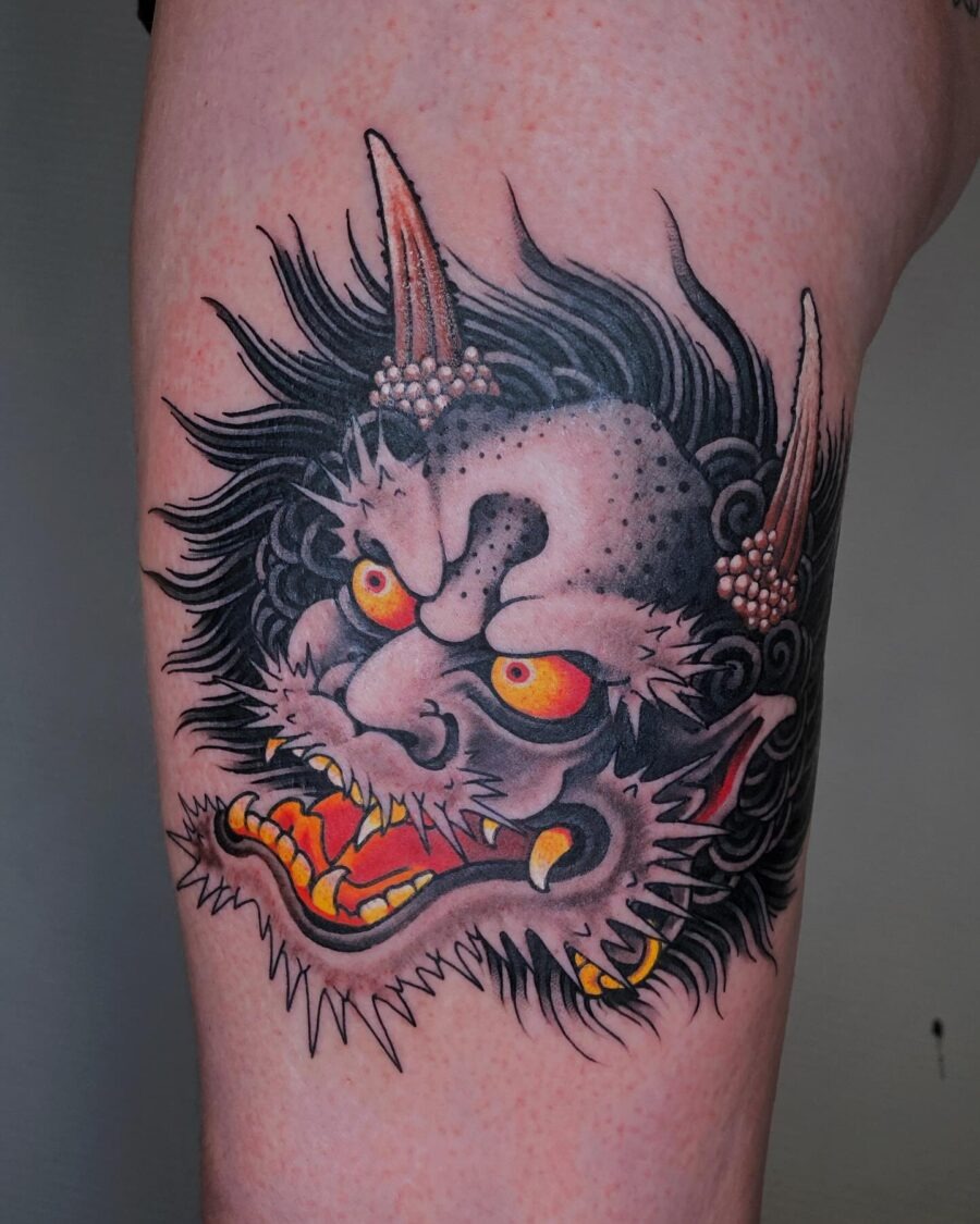 Intense demon face tattoo with vivid colors. Tattoo Design