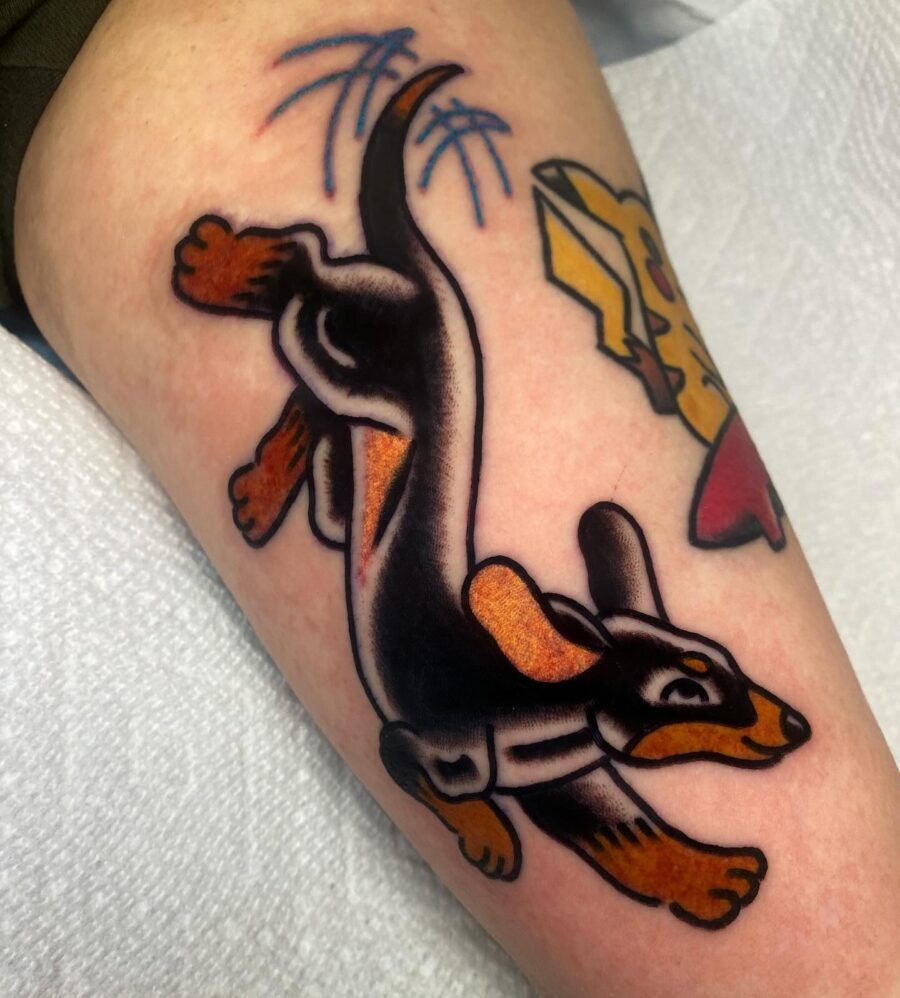 Playful dachshund tattoo in vibrant hues Tattoo Design