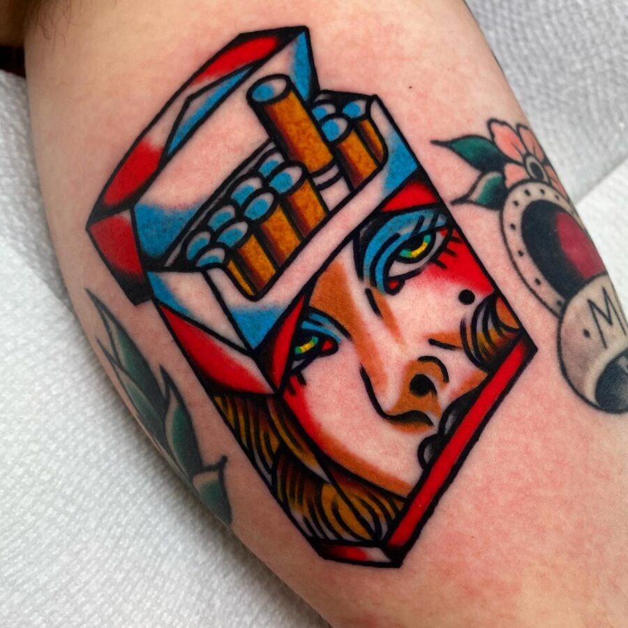 Striking Cigarette Pack with Femme Fatale Imagery Tattoo Design