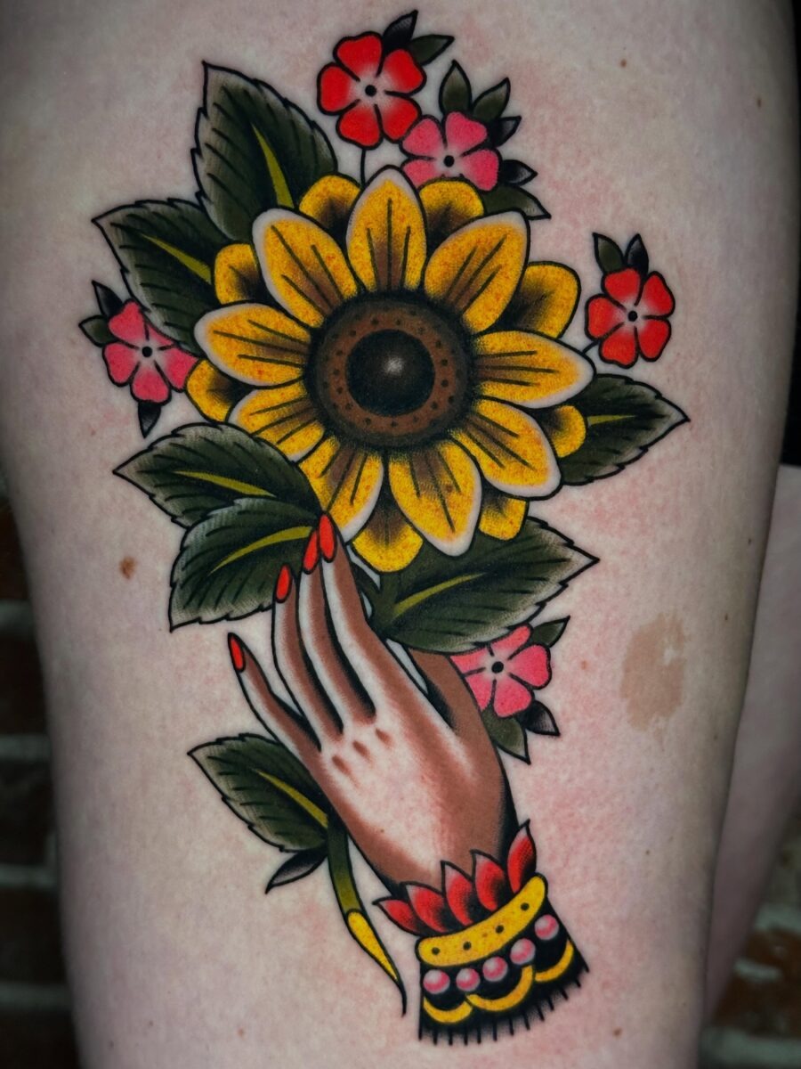 Vibrant Americana Hand with Sunflower and Flowers Tattoo Design