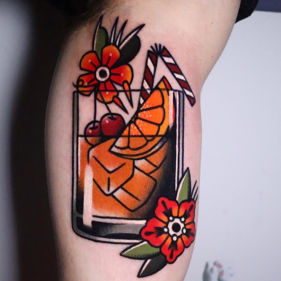 Vibrant cocktail tattoo with floral elements Tattoo Design