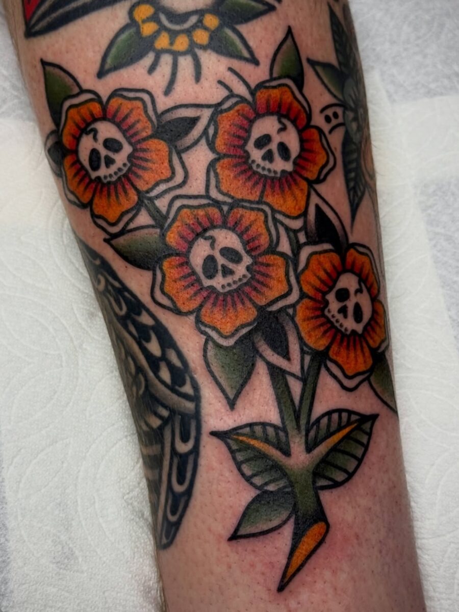 Vibrant Floral Skulls in Americana Style Tattoo Design