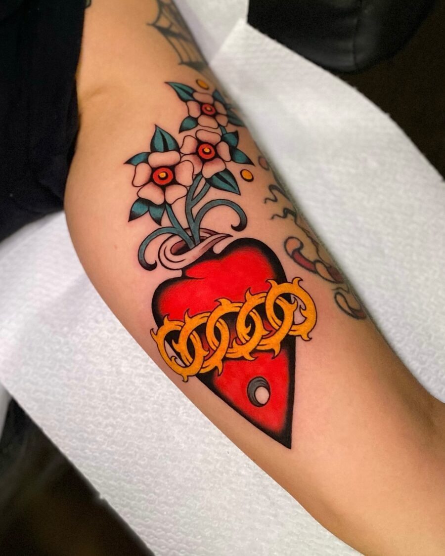 Vibrant flower heart tattoo with chain design Tattoo Design