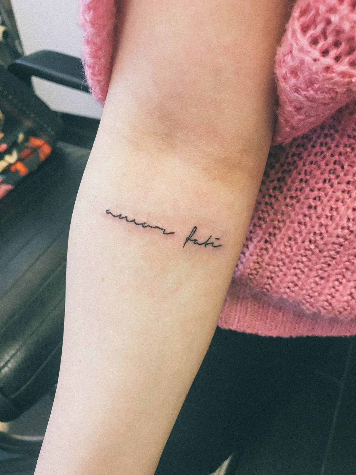 Tiny Minimalist Amor Fati Script Tattoo Design