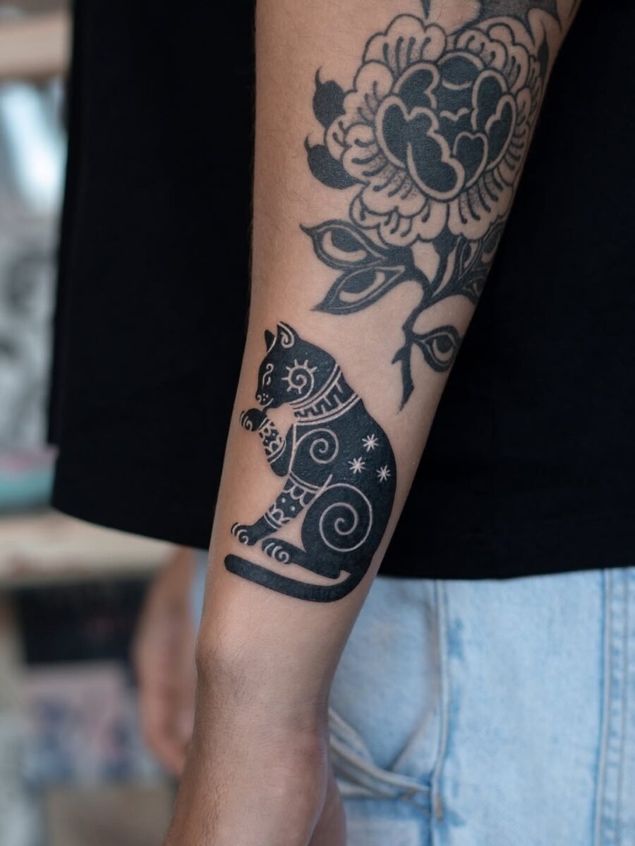 Intricate black cat tattoo with swirling patterns Tattoo Design