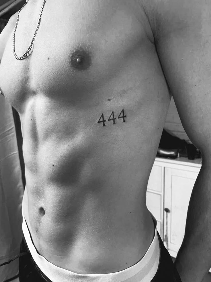 Rounding out our collection is this stunning 444 tattoo on the chest, placed elegantly on the ribcage.