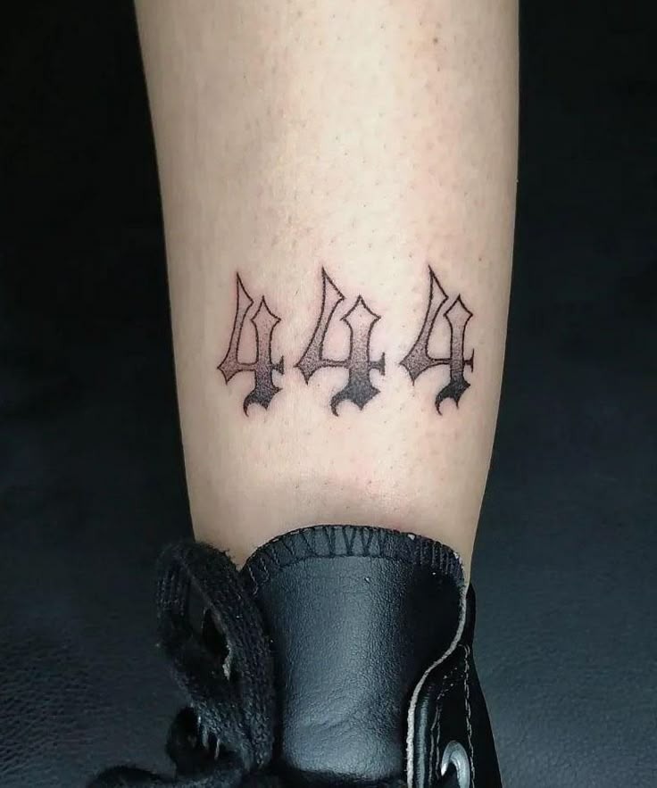 Planted just above the ankle, this 444 tattoo on leg plays with a dark Gothic font that feels timeless and dramatic.