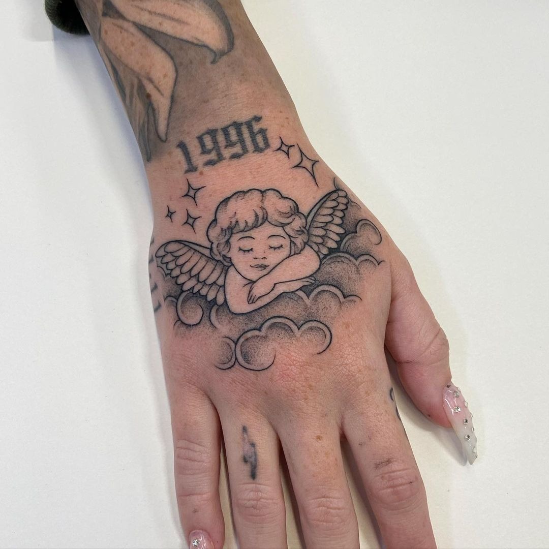 Cloud Cherub Hand Tattoo Tattoo Design
