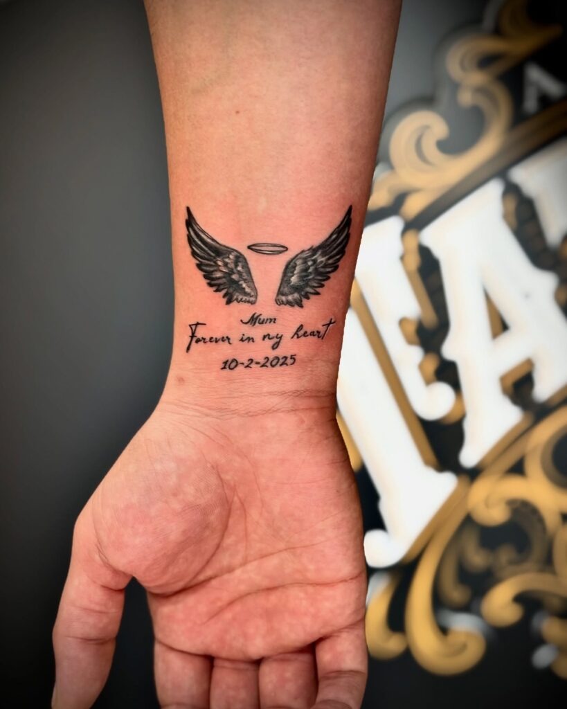 Angel Wings Memorial Tattoo with Roman Numerals Tattoo Design