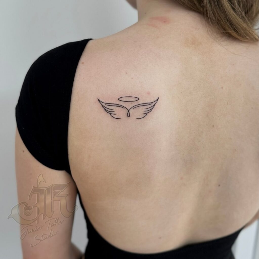 Bold Feathered Wing Half-Sleeve Tattoo Tattoo Design