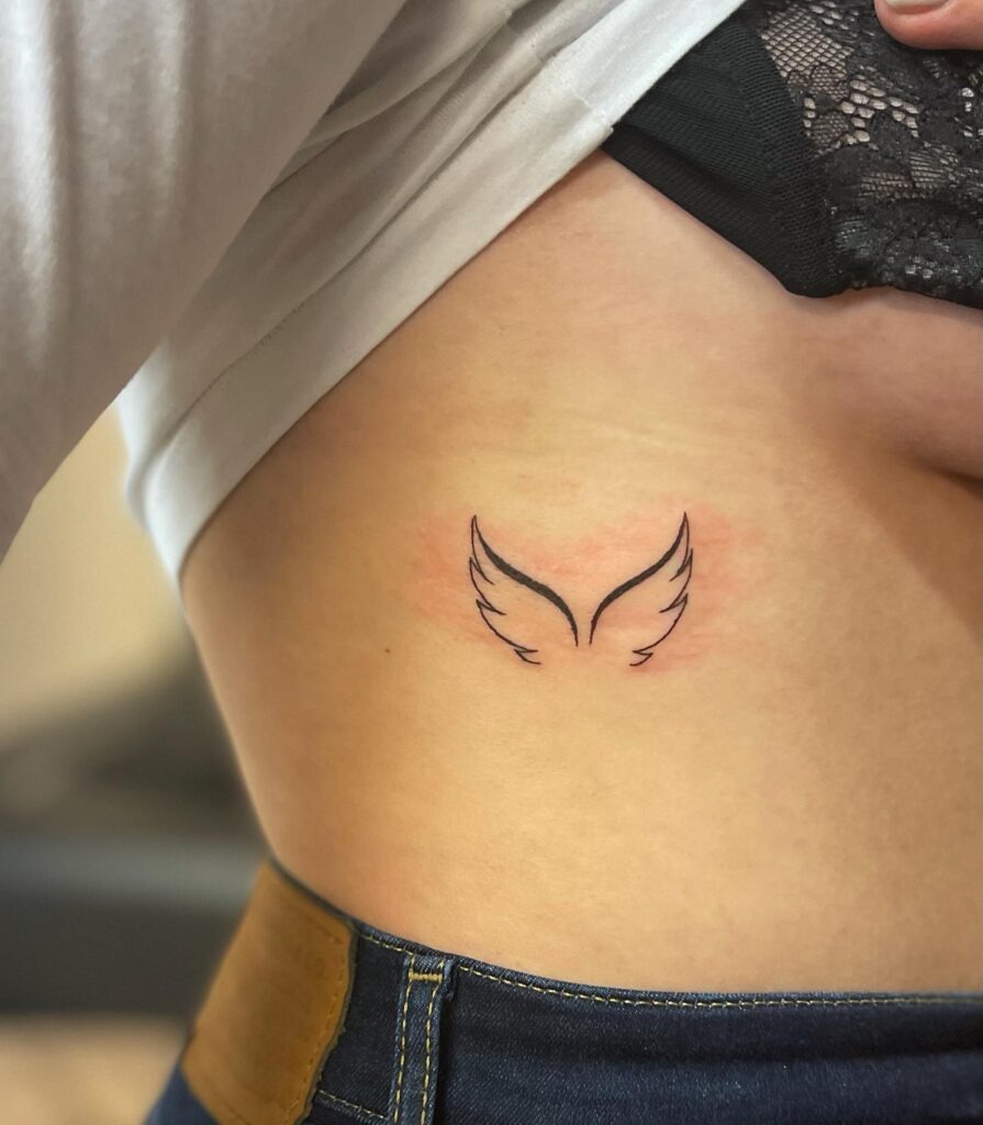 Delicate Fine-Line Angel Wing Underboob Tattoo Tattoo Design