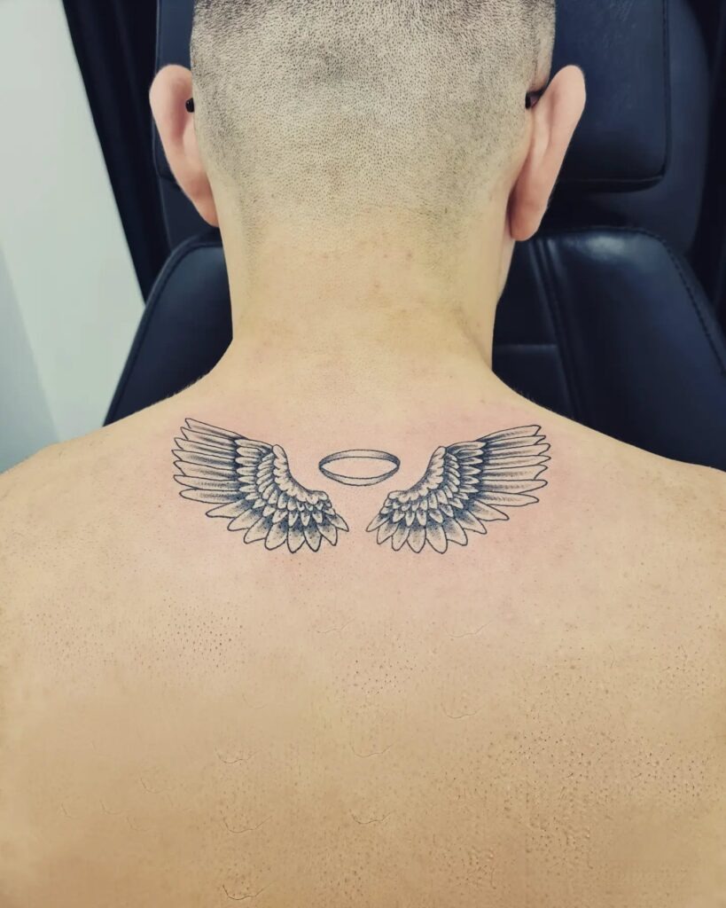 Minimal Single Angel Wing Tattoo on Inner Arm Tattoo Design