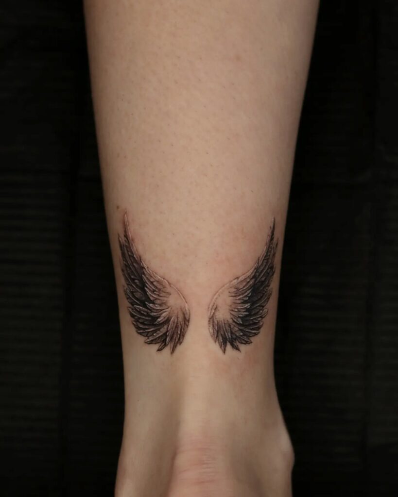 Shaded Angel Wings Tattoo on Arm Tattoo Design