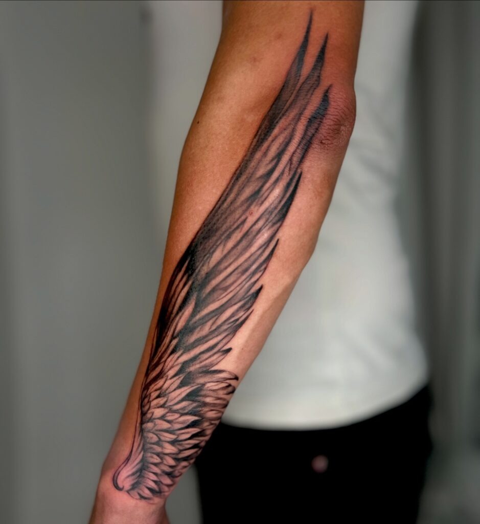 Single Elegant Angel Wing Tattoo Tattoo Design