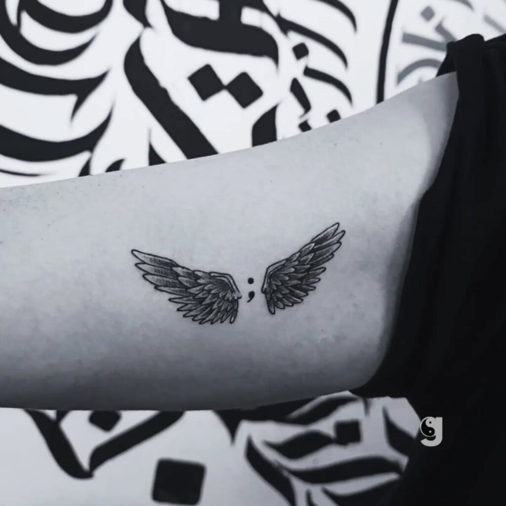 Small Black Angel Wings Tattoo on Collarbone Tattoo Design