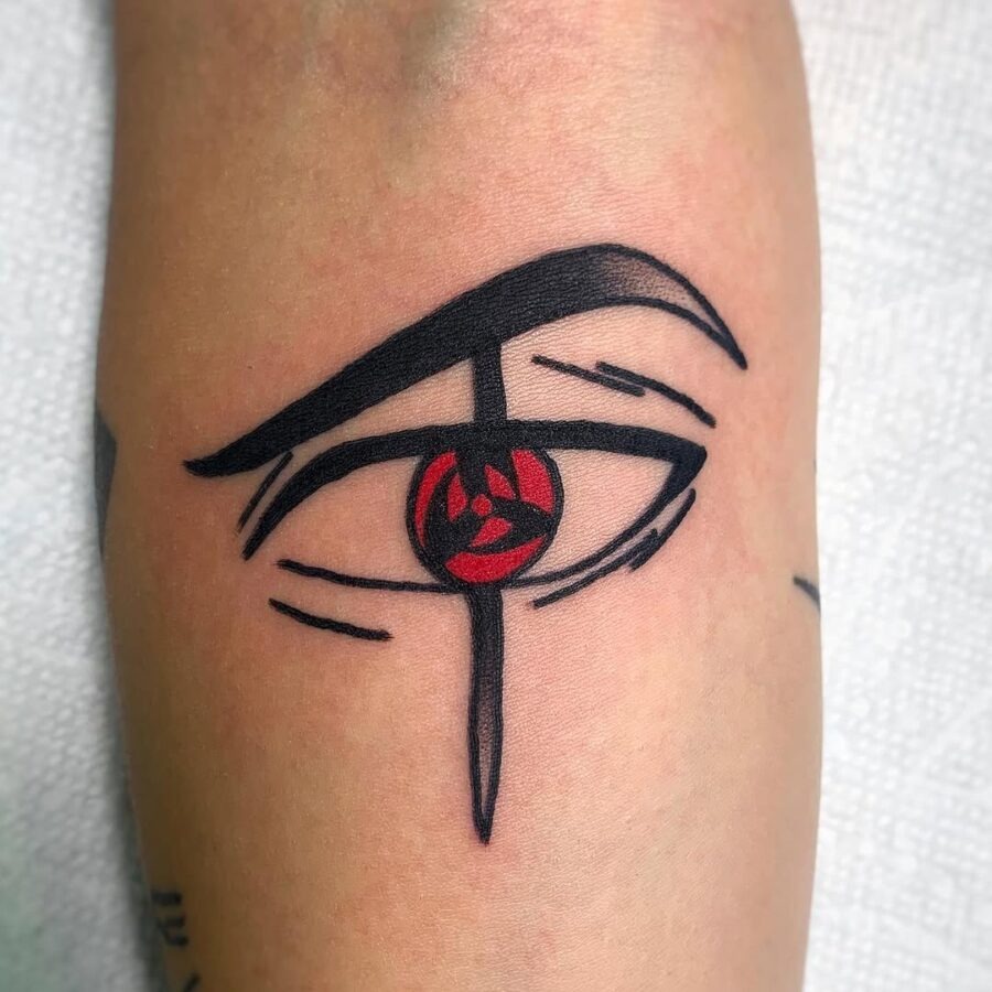 This tattoo features a dynamic eye design, symbolizing both mystery and power.