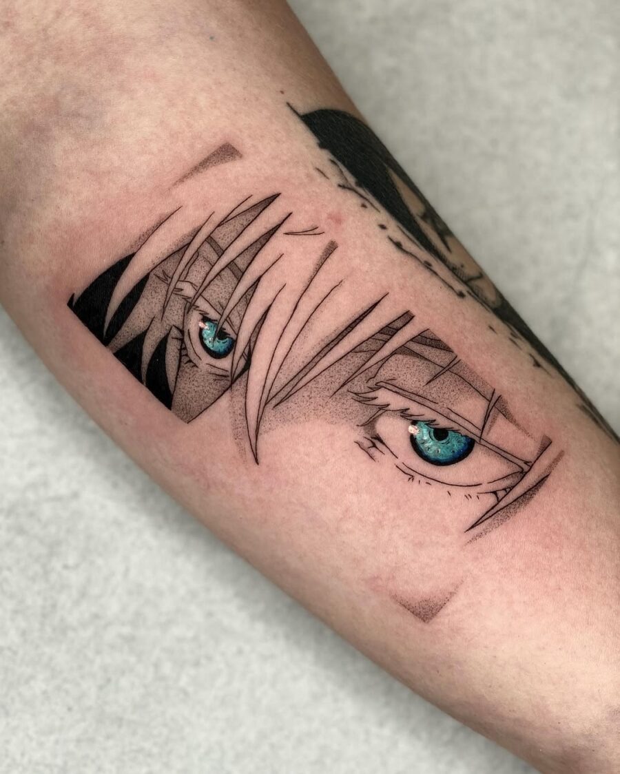 This tattoo showcases striking anime eyes with blue irises.