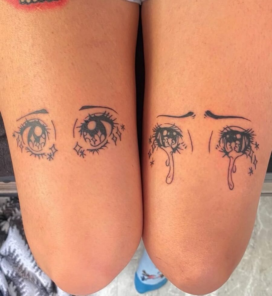 These unique tattoos feature stylized anime eyes adorned with sparkling embellishments.