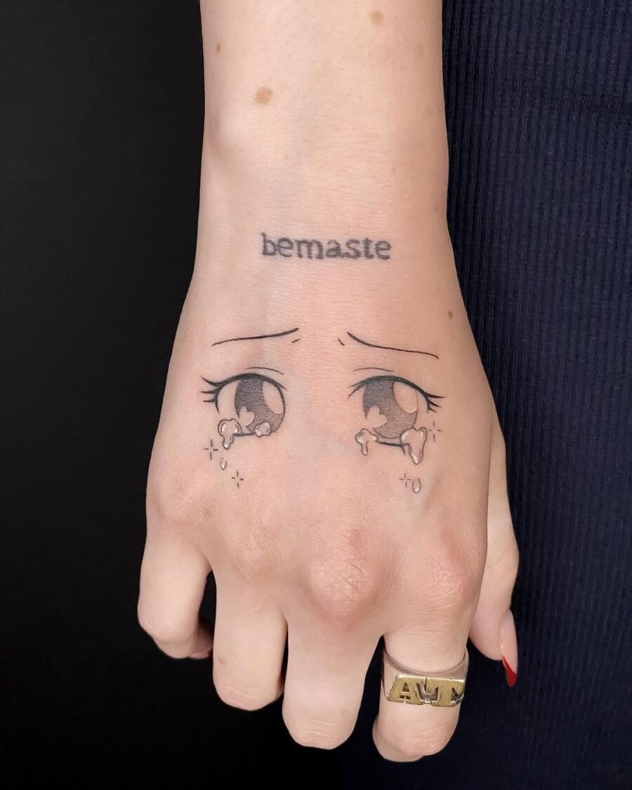 This tattoo showcases enchanting anime eyes, filled with emotion and charm.