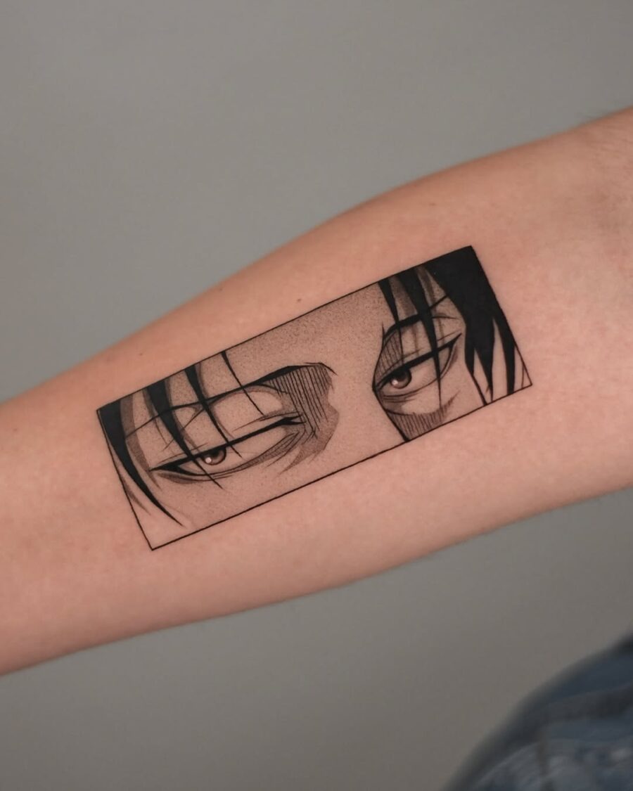 This tattoo features a detailed portrayal of anime eyes, capturing a striking and intense gaze.