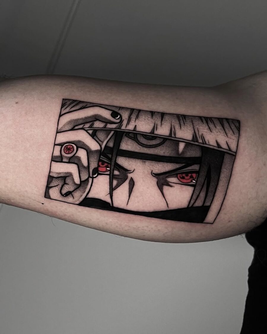 This tattoo showcases a powerful character with intense red eyes.
