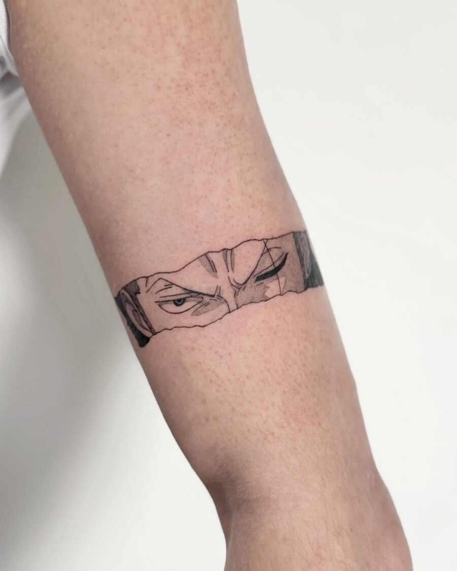 This tattoo features a captivating design of anime eyes peeking through what looks like torn skin.