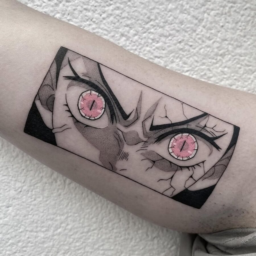 This tattoo showcases a bold anime-inspired design featuring piercing eyes with mesmerizing detail.