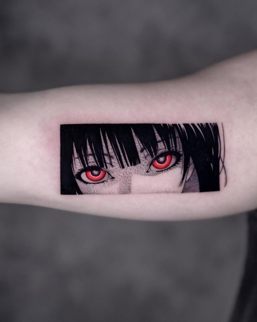 This tattoo features a stunning close-up of piercing red anime eyes, capturing an intense look.