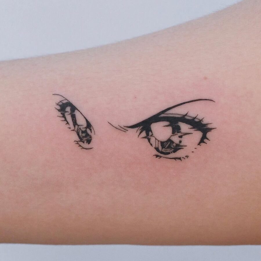 This tattoo features alluring anime eyes, rendered in intricate black line art.
