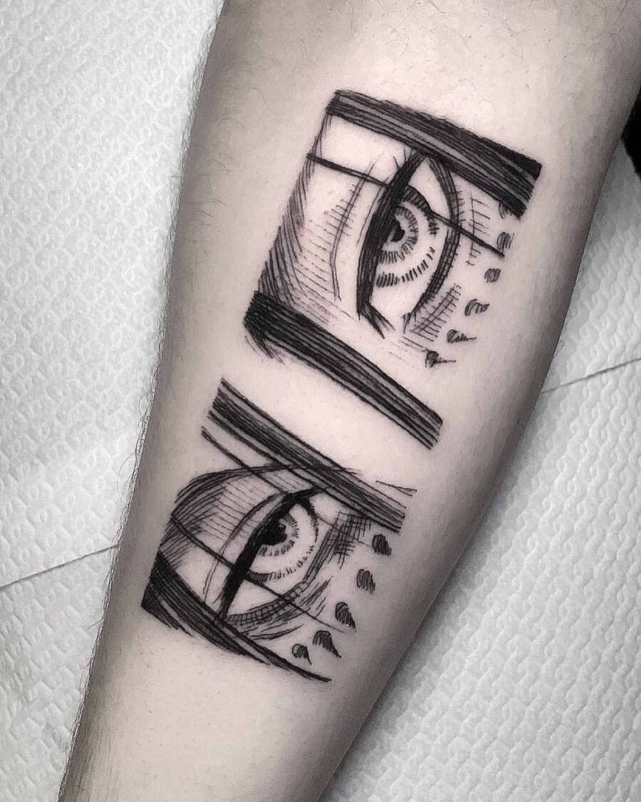 This striking tattoo features two anime eyes in detailed black ink.