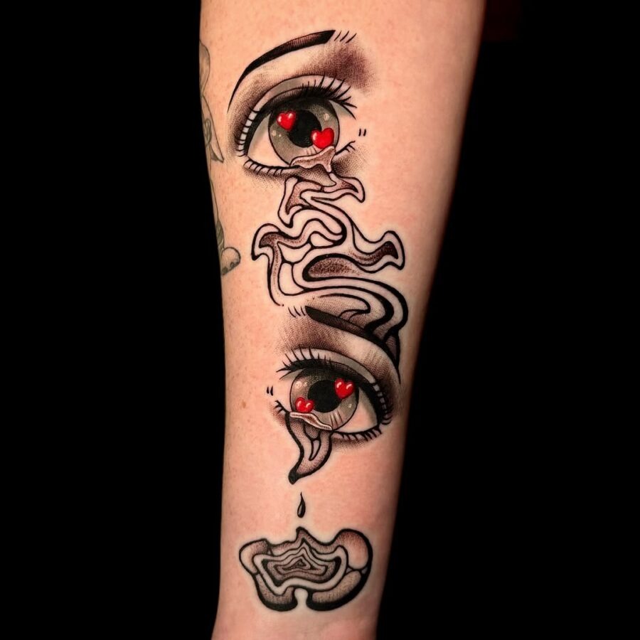 This captivating tattoo features anime-style eyes that draw you in with their intense gaze.