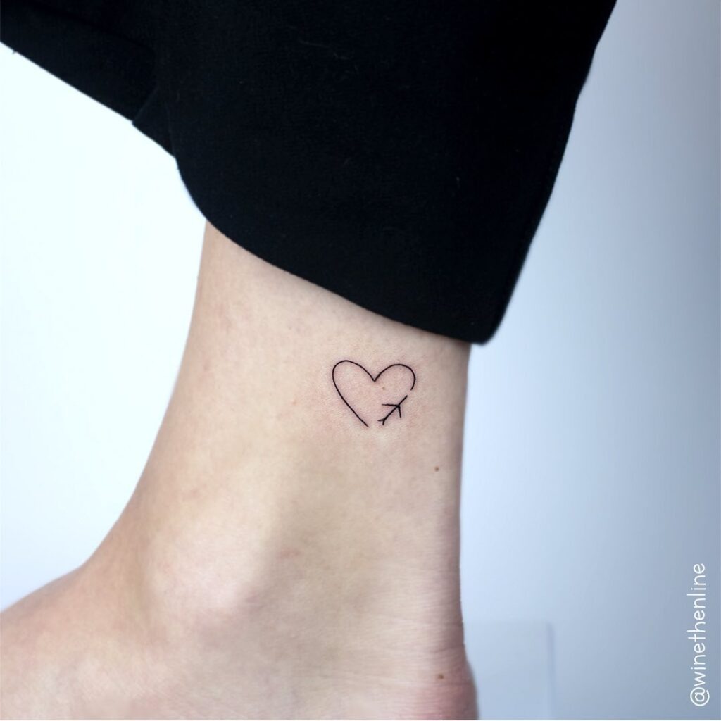 Minimalist Heart with Airplane Ankle Tattoo Tattoo Design
