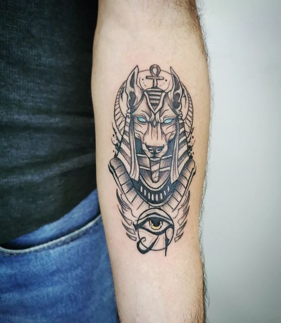 Blue-Eyed Protector with Winged Detail Tattoo Design
