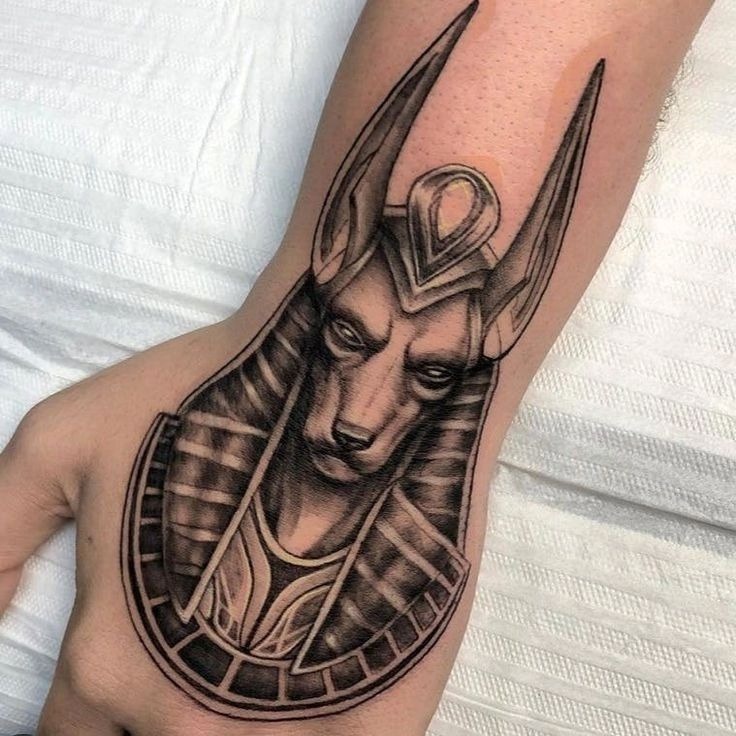 Sun-Crowned Anubis with Scarab Tattoo Design