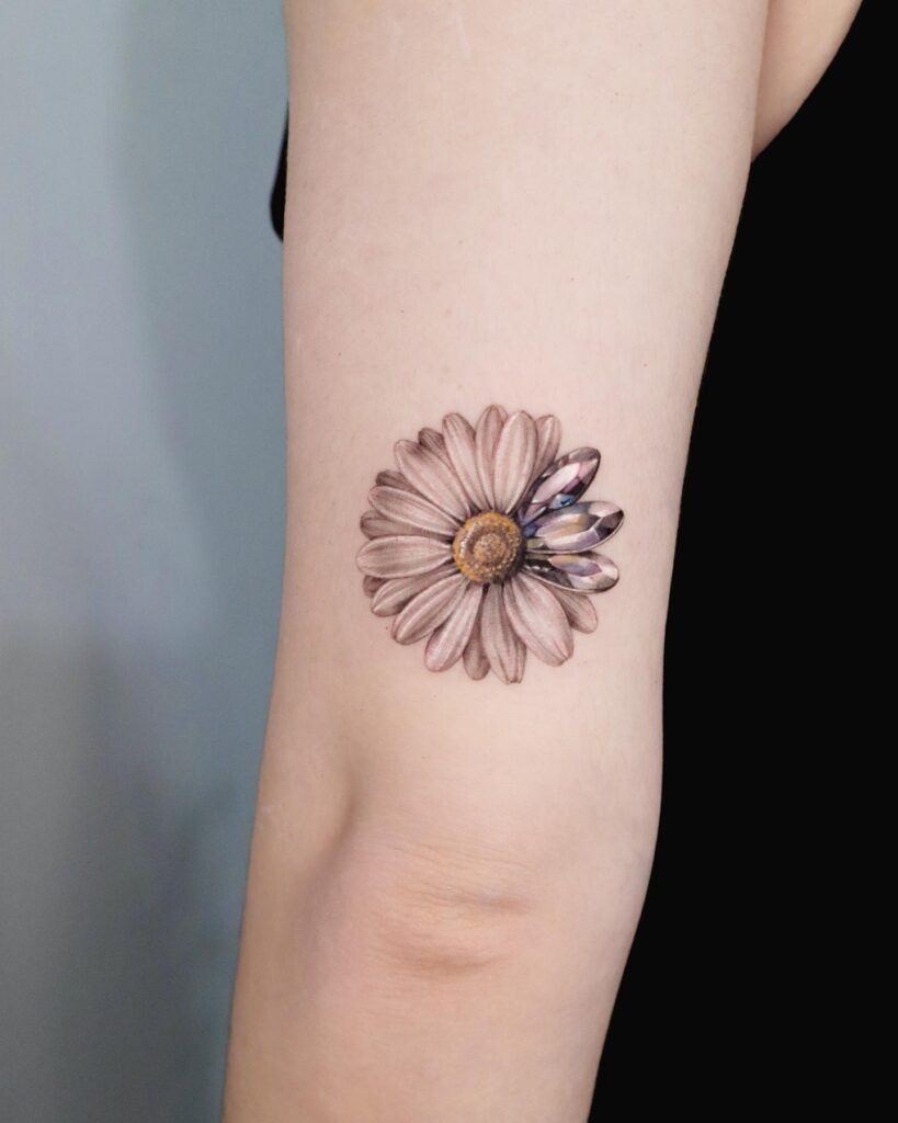 Elegant Daisy Forearm Tattoo with Flowing Design Tattoo Design
