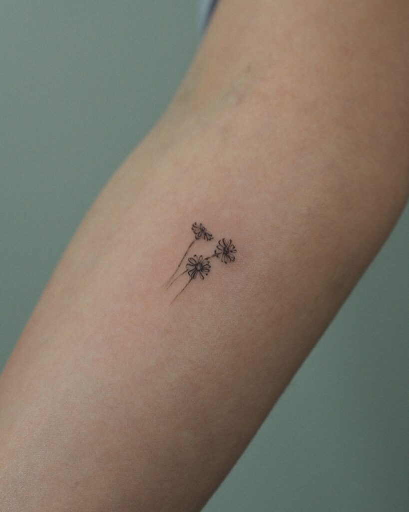 Realistic Daisy Tattoo on Forearm Tattoo Design