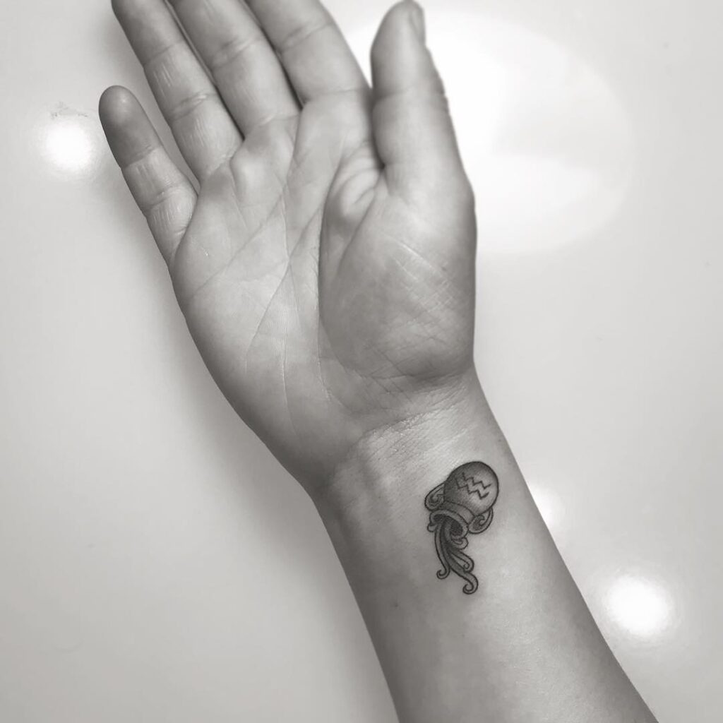Minimalist Aquarius Jellyfish Tattoo on the Wrist Tattoo Design