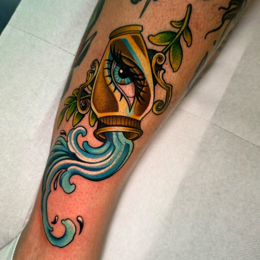 Vibrant Aquarius Vase Tattoo with Eye and Flowing Water Tattoo Design