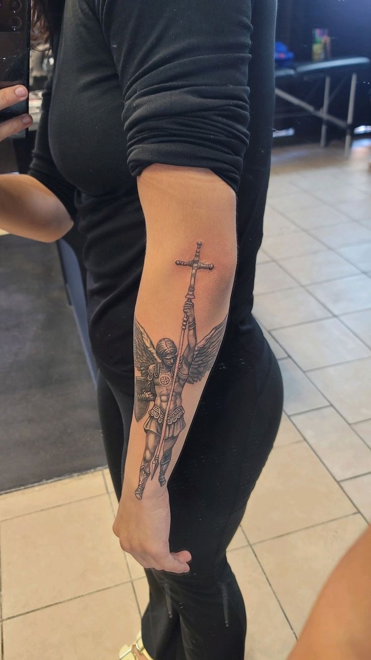 Minimal Archangel with Raised Cross Tattoo Design