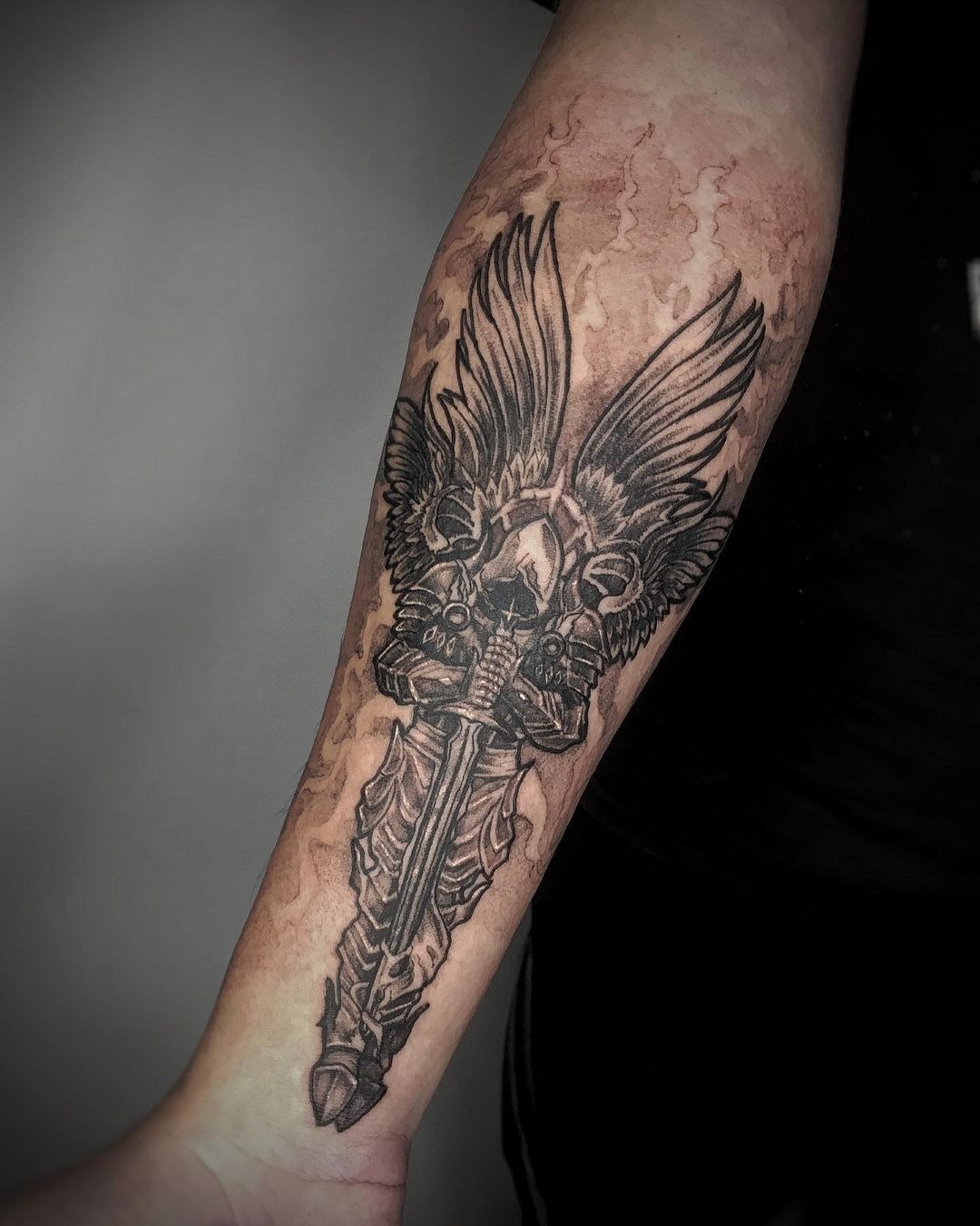 Minimal Winged Sword Symbol Tattoo Design