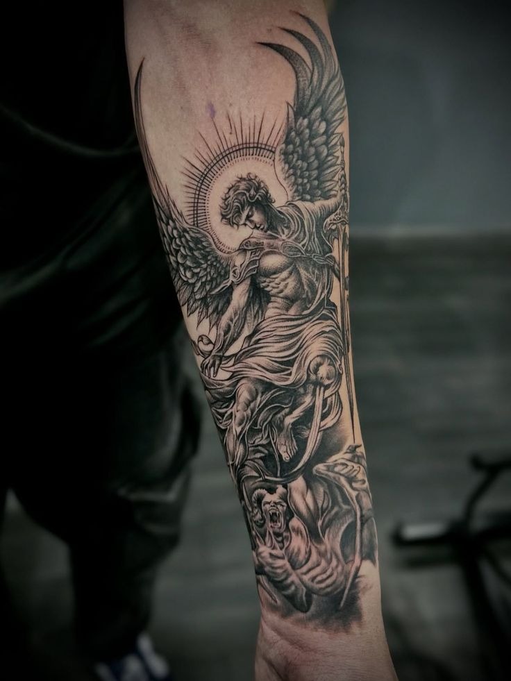 Saint Michael Confronting Darkness Below Tattoo Design